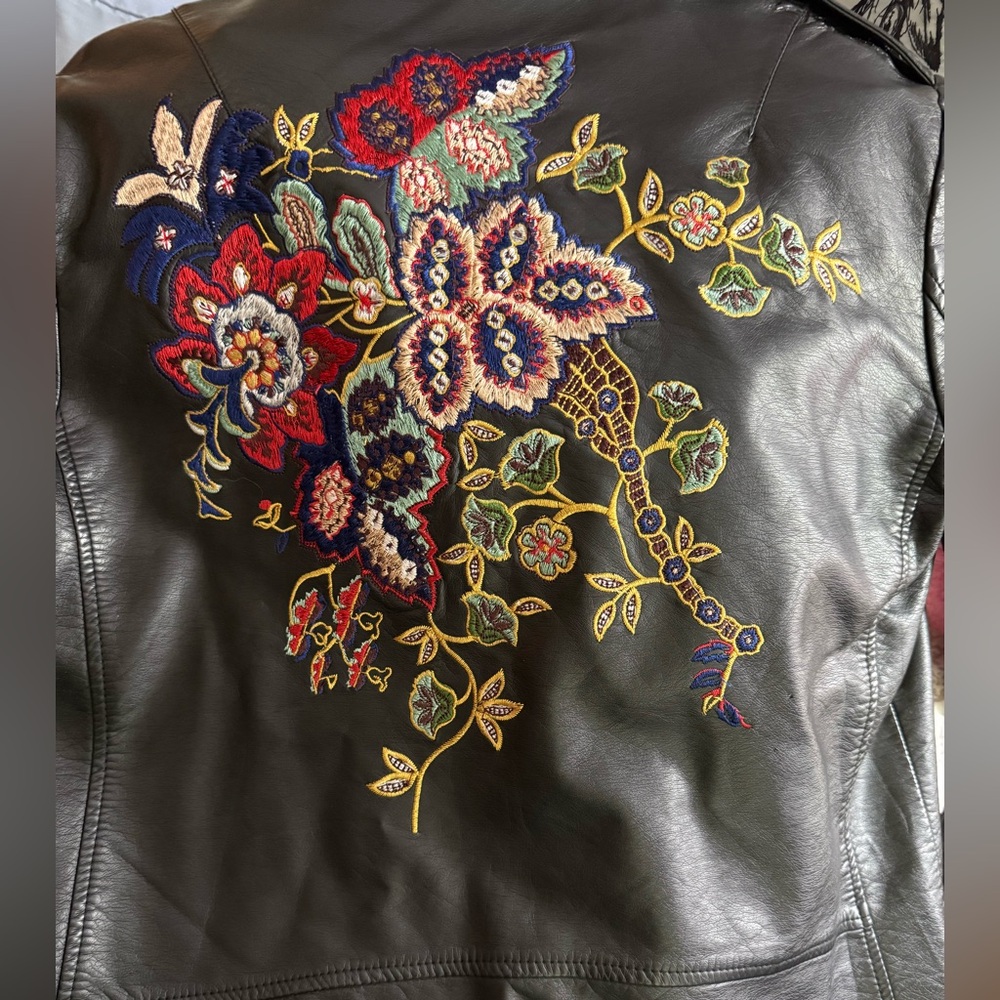 Christina Black Leather Jacket with Asymmetrical Zippers and Silver Hardware